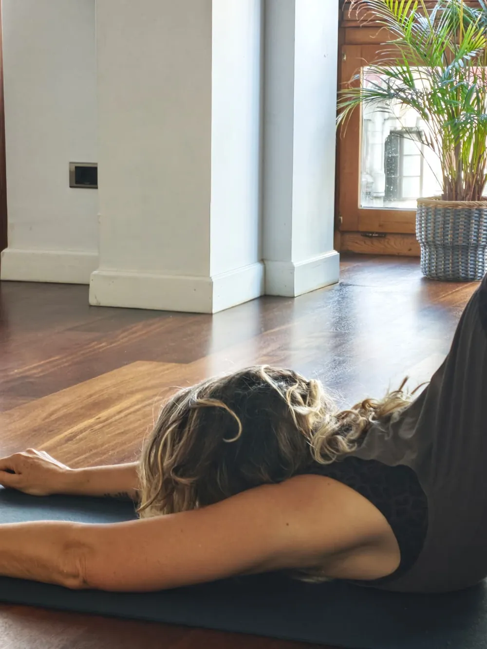 Resting Yin Yoga pose on the mat